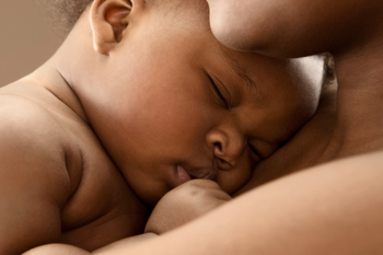 black mom holding baby 