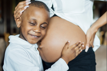 boy hugging belly
