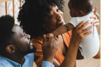 black man and woman with baby